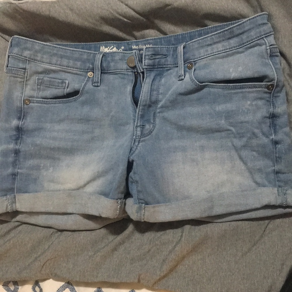 Light blue mid rise denim shorts.